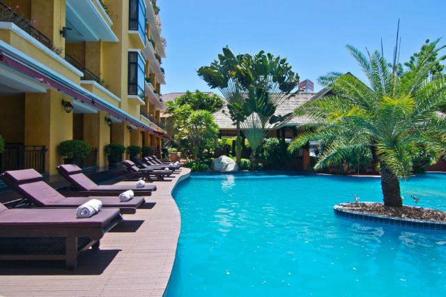 Tropical Swimming Pool enjoy a sunshine day at the sun terrace. 